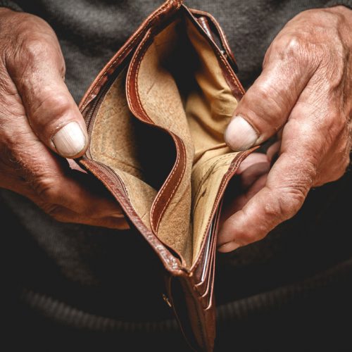 Man showing his empty wallet